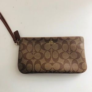 Coach wristlet in signature canvas